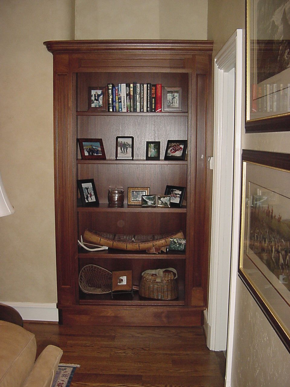 Bookcase installed in corner niche.