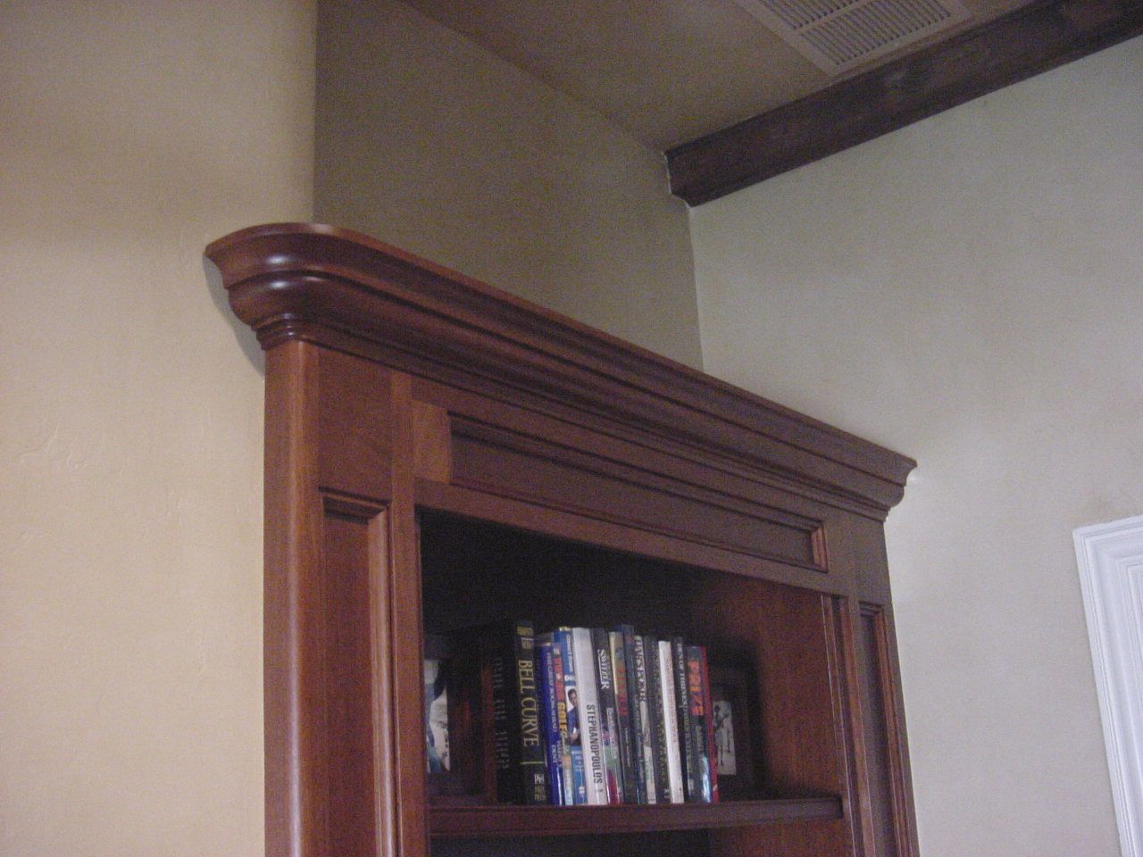 Close up of bookcase top.