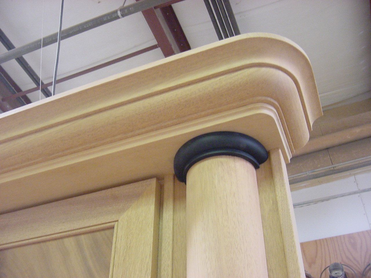 Cabinet top, crown, and column capital.