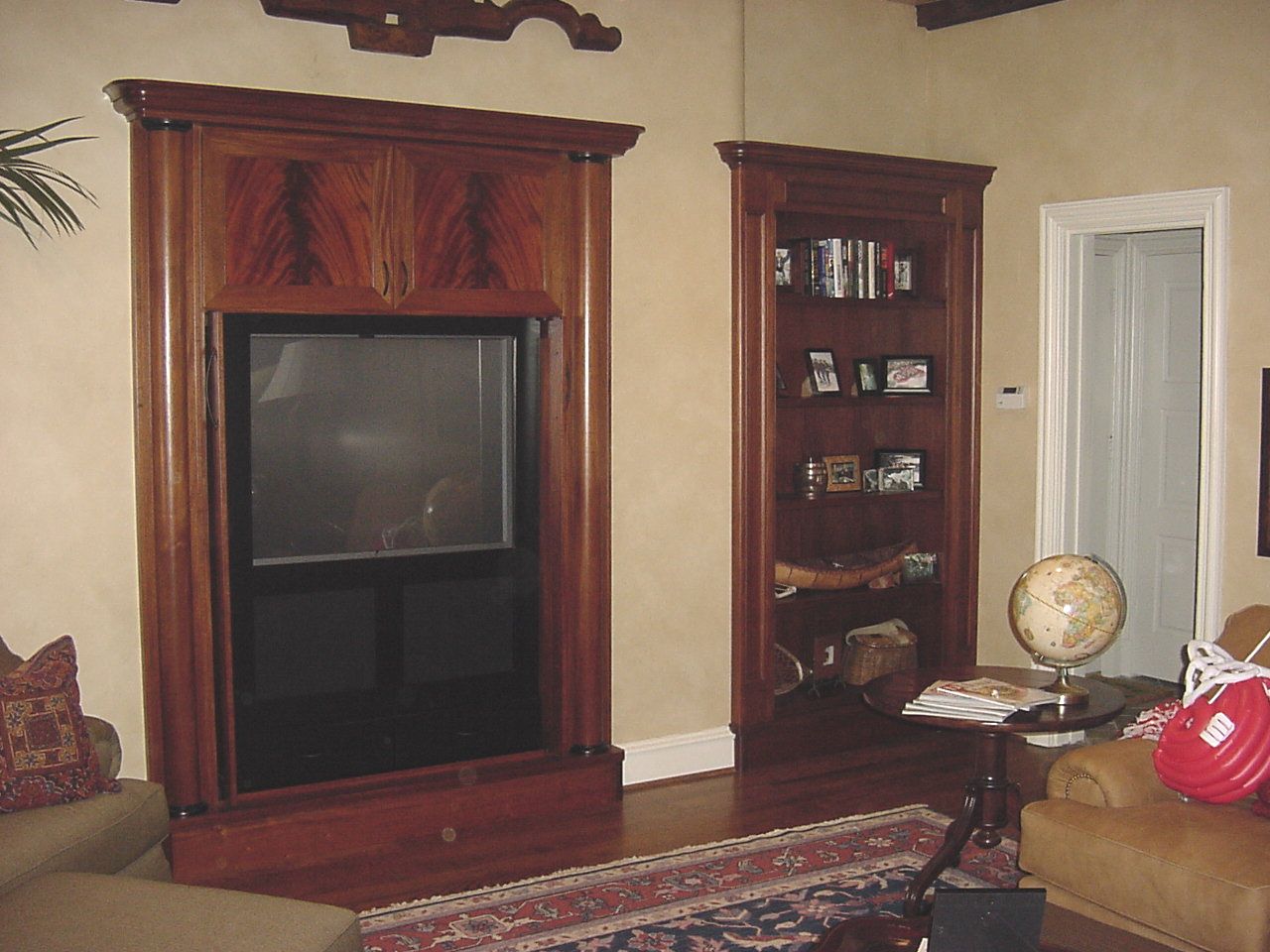 Mahogany cabinet open and bookcase